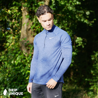 Men's Nike Therma 1/4 Zip Top in a Royal Blue colourway showing the Side design worn by our model, dripuniqueuk