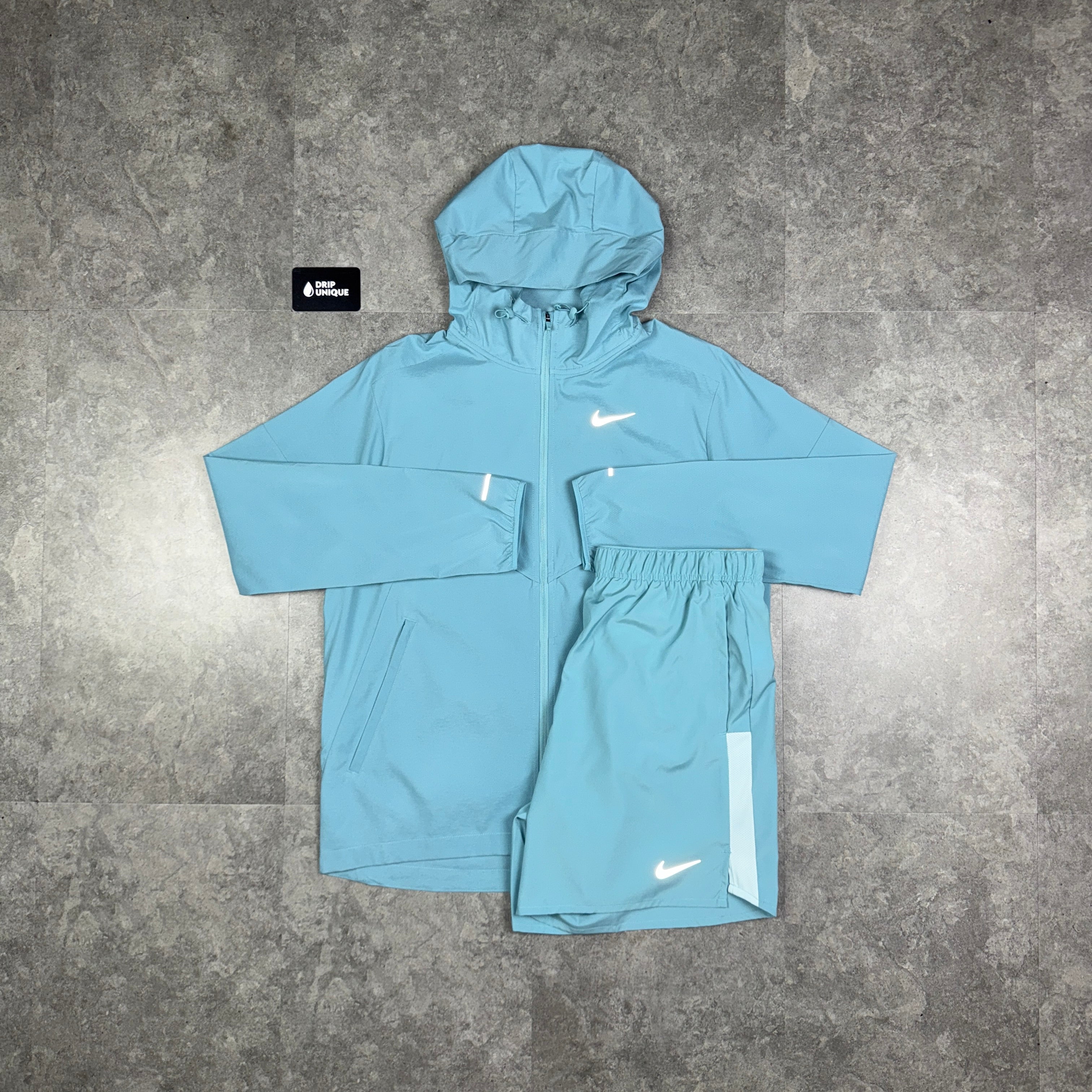 turquoise nike windbreaker