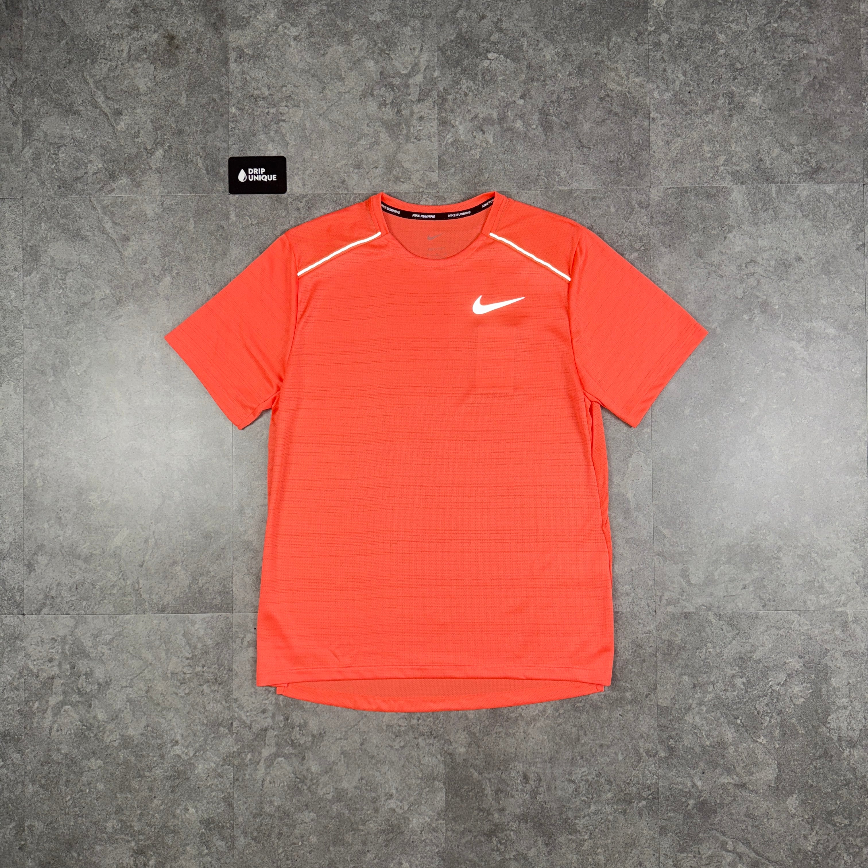 peach color nike shirt