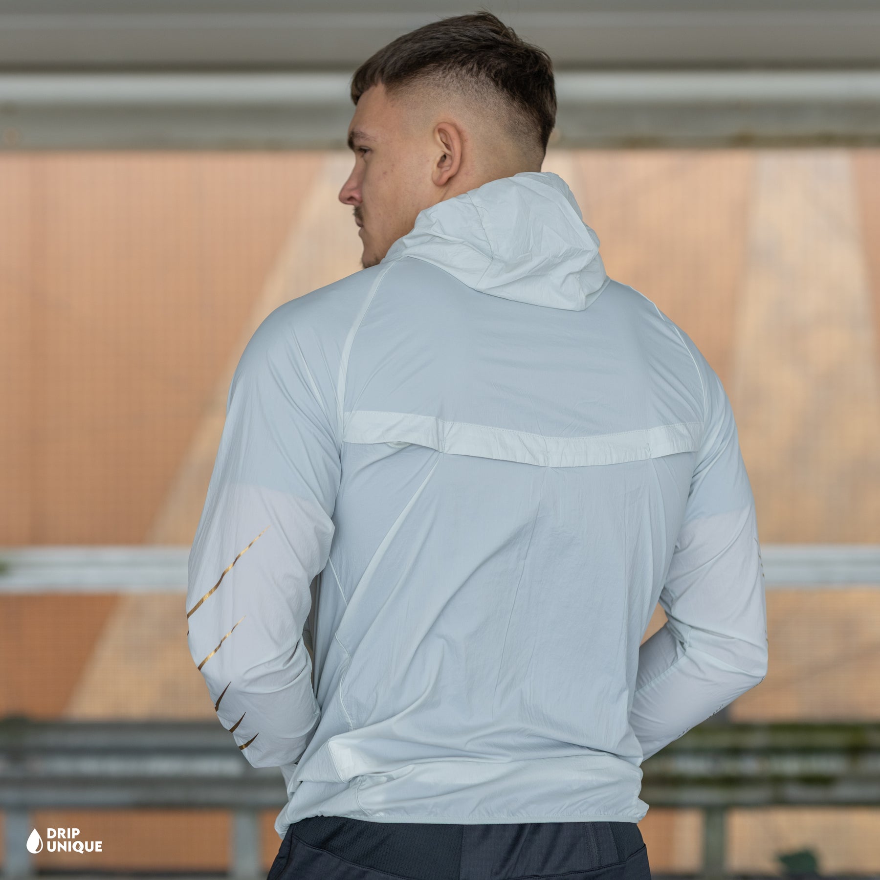 white and gold nike windrunner