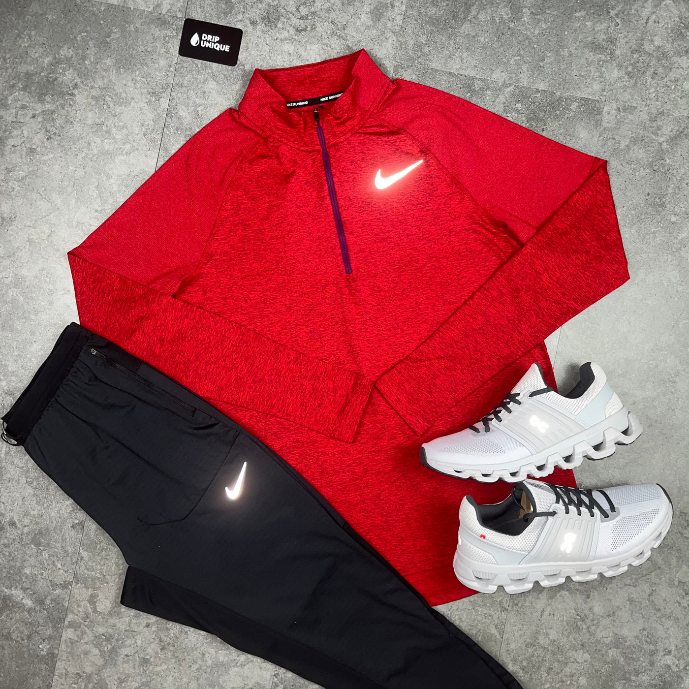 Men's Nike Therma 1/4 Zip Top in a Red colourway close up paired with Nike Black Phenom pants and White On running Cloudswift 3's, dripuniqueuk