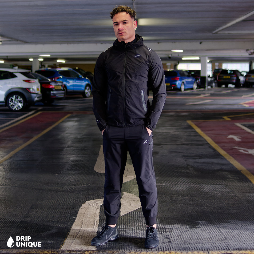 Men's ActiveLine Malay Jacket Blackout, ActiveLine Clothing, showcasing the ActiveLine Malay Jacket in the Blackout colourway, combined with the black onyx activeline pants to complete the look, worn by our model, dripuniqueuk