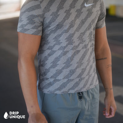 Men's Jacquard Nike Miler T-Shirt Grey & Grey Flex Stride Shorts Set, showing the close up of the Miler T-Shirt, dripuniqueuk