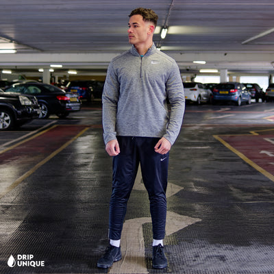 Men's Nike Pacer 1/4 Zip Top in Grey, showcasing the front design, paired with the nike elite phenom pants to complete the look, dripuniqueuk