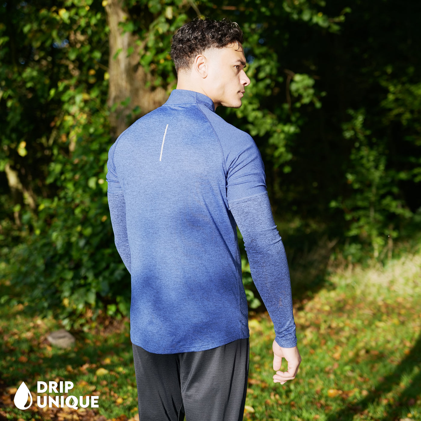 Men's Nike Therma 1/4 Zip Top in a Royal Blue colourway showing the back design worn by our model, dripuniqueuk