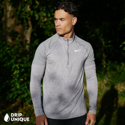 Men's Nike Therma 1/4 Zip Top in a Grey colourway showing a close up, dripuniqueuk